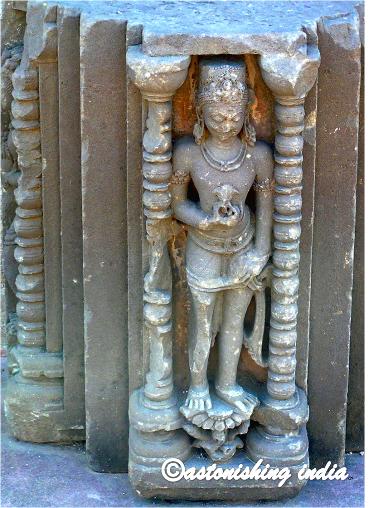 Statue in a niche on wall