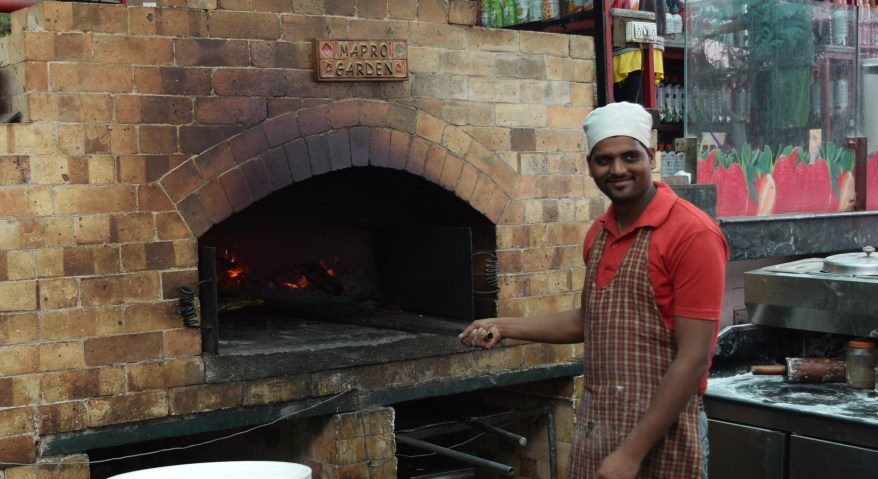 Santosh...head cook at pizza oven