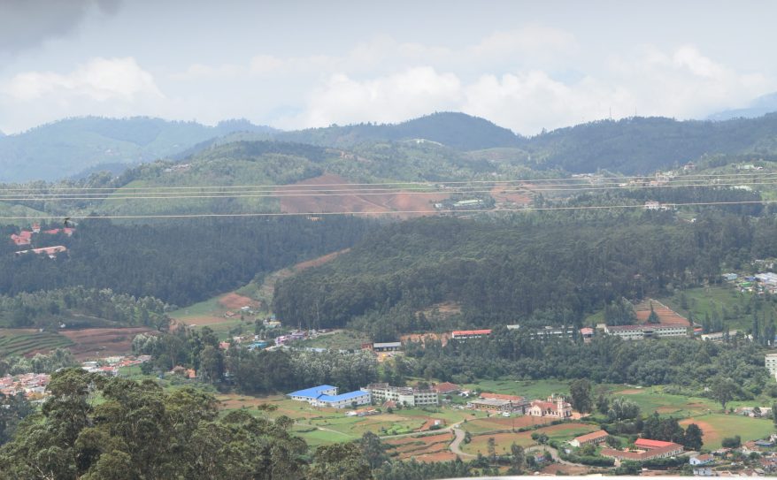 Red mud shingled hutments along the way