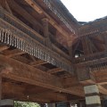 overhanging wooden balconies supported by wood&nbsp;rafters