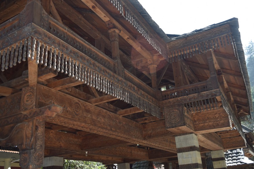Overhanging wooden balconies supported by wood rafters