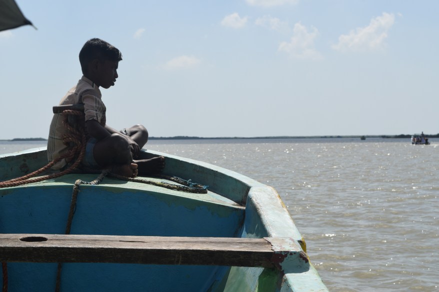 Younger boy of the boatman