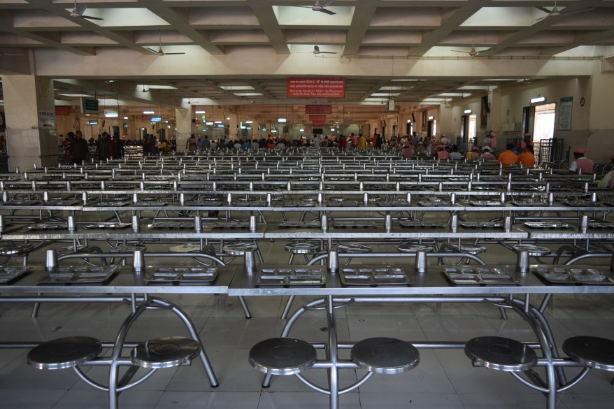Rows of dining tables for the devotees seeking prasad meal