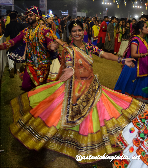 A woman swirling away to beats at United Way Garba 