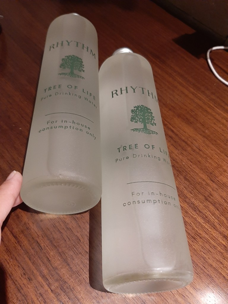 glass bottles with the resort logo