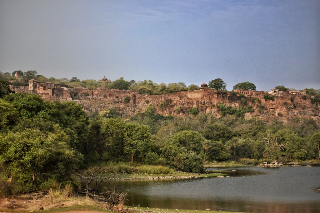 ramparts of fort at the horizon with a lake in forefront